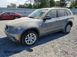 2011 BMW X5 35i z VIN 5UXZV4C50BL743135, wystawiony jako Copart lot #75401064 z przebiegiem 100 446 mil mil oraz Szkoda całkowita • Salvage title. Historia ofert i sprzedaży dostępna na DreamBid. Obrazek 1.