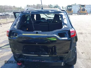 2014 Jeep Cherokee Trailhawk with VIN 1C4PJMBB6EW162303, listed as a IAAI auction lot 41910167 with 133,669 mi miles. Bid and sale history available at carsss.com. Image 6.