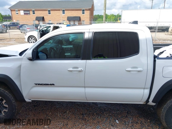 2023 Toyota Tacoma SR with VIN 3TMCZ5AN7PM639378, listed as a IAAI auction lot 42222407 with 38,172 mi miles and . Bid and sale history available at DreamBid. Image 14.