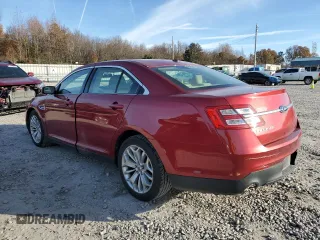 2014 Ford Taurus Limited with VIN 1FAHP2F81EG183128, listed as a Copart auction lot 82409384 with 107,624 mi miles and Salvage title. Bid and sale history available at DreamBid. Image 2.