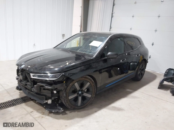 2023 BMW iX xDrive50 with VIN WB523CF04PCL15607, listed as a IAAI auction lot 41315457 with 44,058 mi miles. Bid and sale history available at carsss.com. Image 2.