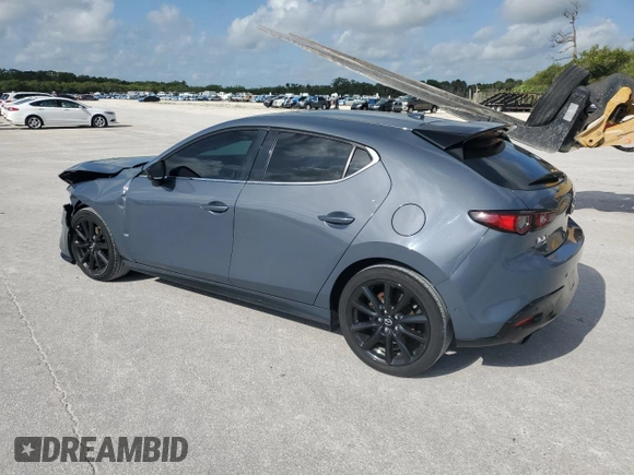 2021 Mazda 3 Premium Plus with VIN JM1BPBNYXM1403126, listed as a Copart auction lot 59971535 with 56,952 mi miles and Salvage title. Bid and sale history available at DreamBid. Image 2.