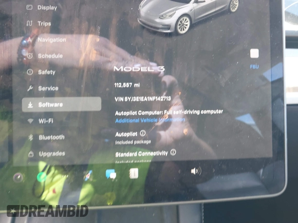 2022 Tesla Model 3 with VIN 5YJ3E1EA1NF142713, listed as a IAAI auction lot 42027630 with 112,557 mi miles. Bid and sale history available at carsss.com. Image 7.