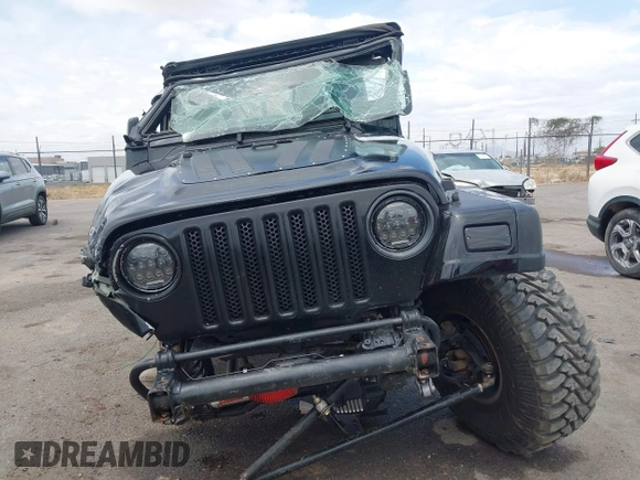 2004 Jeep Wrangler Rubicon z VIN 1J4FA69S84P727716, wystawiony jako IAAI lot #42162129 z przebiegiem 90 844 mil mil oraz . Historia ofert i sprzedaży dostępna na DreamBid. Obrazek 13.