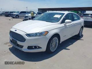 2014 Ford Fusion SE Hybrid with VIN 3FA6P0LUXER233658, listed as a IAAI auction lot 42311588 with 106,282 mi miles and . Bid and sale history available at DreamBid. Image 2.