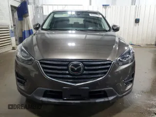 2016 Mazda CX-5 Grand Touring with VIN JM3KE4DY4G0600877, listed as a Copart auction lot 85560194 with 82,395 mi miles and Salvage Title. Bid and sale history available at carsss.com. Image 5.