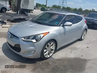 2012 Hyundai Veloster w/Gray Int with VIN KMHTC6ADXCU028115, listed as a IAAI auction lot 42361550 with 118,920 mi miles and . Bid and sale history available at DreamBid. Image 2.