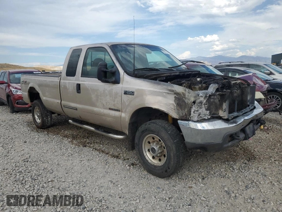 1999 Ford F-250 XL with VIN 1FTNX21F8XEE00658, listed as a Copart auction lot 70021594 with 218,084 mi miles and Non Repairable. Bid and sale history available at DreamBid. Image 4.