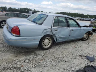 1999 Ford Crown Victoria LX with VIN 2FAFP74WXXX137154, listed as a Copart auction lot 71418784 with 97,589 mi miles and Salvage Title. Bid and sale history available at carsss.com. Image 3.
