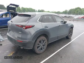 2023 Mazda CX-30 S Carbon Edition with VIN 3MVDMBCM9PM574358, listed as a IAAI auction lot 42105931 with 55,975 mi miles and . Bid and sale history available at DreamBid. Image 4.