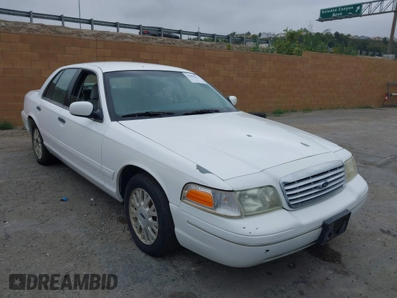 2003 Ford Crown Victoria LX z VIN 2FAFP74WX3X154904, wystawiony jako IAAI lot #42094274 z przebiegiem 123 579 mil mil oraz . Historia ofert i sprzedaży dostępna na DreamBid. Obrazek 1.
