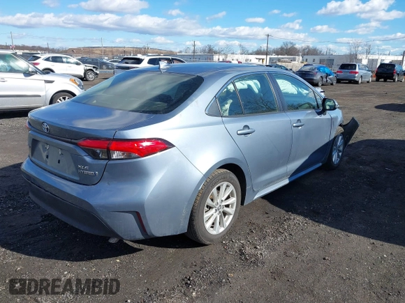 2023 Toyota Corolla Hybrid LE with VIN JTDBCMFE4P3025924, listed as a IAAI auction lot 41463750 with 9,553 mi miles. Bid and sale history available at carsss.com. Image 4.