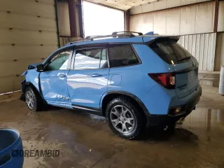 2024 Honda Passport TrailSport z VIN 5FNYF8H61RB013217, wystawiony jako Copart lot #52349015 z przebiegiem 8 360 mil mil oraz Szkoda całkowita • Salvage title. Historia ofert i sprzedaży dostępna na DreamBid. Obrazek 2.