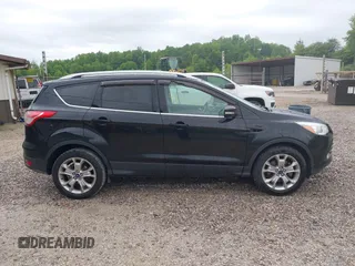 2016 Ford Escape Titanium with VIN 1FMCU9J93GUB93729, listed as a IAAI auction lot 42177294 with 158,859 mi miles and . Bid and sale history available at DreamBid. Image 13.