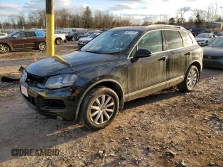 2012 Volkswagen Touareg Sport with VIN WVGEF9BP7CD006020, listed as a Copart auction lot 88211145 with 180,729 mi miles and Salvage Title. Bid and sale history available at DreamBid. Image 1.
