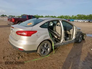 2017 Ford Focus SE with VIN 1FADP3F22HL274842, listed as a Copart auction lot 60970745 with 154,210 mi miles and Salvage title. Bid and sale history available at DreamBid. Image 3.