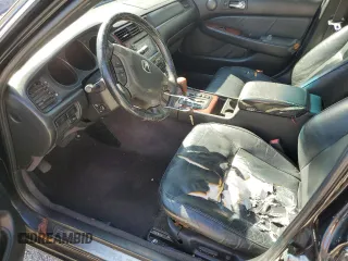 2004 Acura RL w/Navigation System with VIN JH4KA96624C004656, listed as a Copart auction lot 77021014 with 158,857 mi miles and Salvage Title. Bid and sale history available at carsss.com. Image 7.