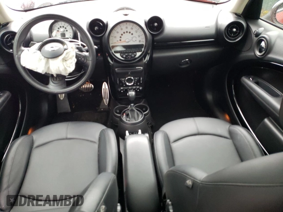 2014 MINI Countryman S with VIN WMWZC3C52EWP25379, listed as a Copart auction lot 61438355 with 76,943 mi miles and Salvage title. Bid and sale history available at DreamBid. Image 8.