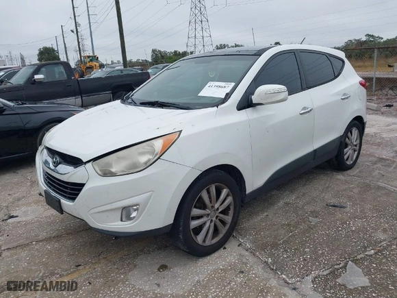 2013 Hyundai Tucson GLS with VIN KM8JU3AC8DU599937, listed as a IAAI auction lot 41398687 with 207,048 mi miles. Bid and sale history available at carsss.com. Image 2.