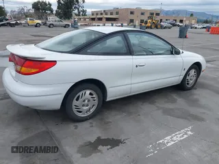 1999 Saturn SC with VIN 1G8ZY1271XZ276834, listed as a IAAI auction lot 41445985 with 62,428 mi miles. Bid and sale history available at carsss.com. Image 4.