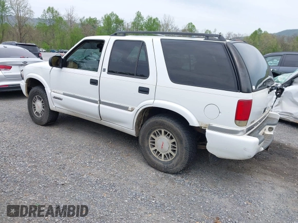 1999 GMC Jimmy SLE with VIN 1GKDT13WXX2521082, listed as a IAAI auction lot 42079903 with 160,055 mi miles. Bid and sale history available at carsss.com. Image 3.