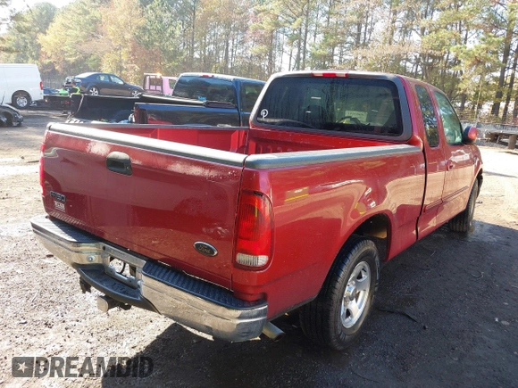 2000 Ford F-150 XL with VIN 1FTRX17L7YKA59717, listed as a IAAI auction lot 40887691 with 104,095 mi miles. Bid and sale history available at carsss.com. Image 4.