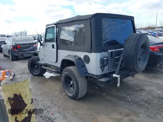 2005 Jeep Wrangler Unlimited with VIN 1J4FA44S25P340852, listed as a IAAI auction lot 41441671 with 139,302 mi miles. Bid and sale history available at carsss.com. Image 3.