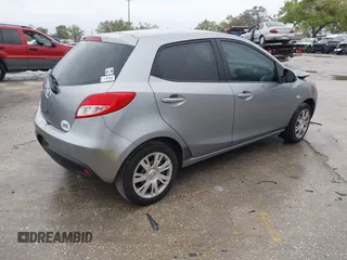 2013 Mazda Mazda2 Sport with VIN JM1DE1KY6D0170767, listed as a IAAI auction lot 41761689 with 142,743 mi miles. Bid and sale history available at carsss.com. Image 4.