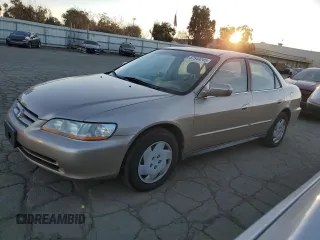 2001 Honda Accord LX z VIN 1HGCG16461A067174, wystawiony jako Copart lot #87543245 z przebiegiem 148 410 mil mil oraz Czysty tytuł • Clean title. Historia ofert i sprzedaży dostępna na DreamBid. Obrazek 1.