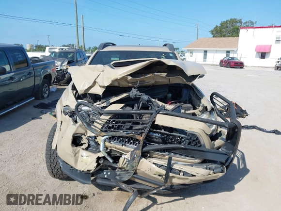 2018 Toyota Tacoma SR5 z VIN 3TMDZ5BN4JM039802, wystawiony jako IAAI lot #42300924 z przebiegiem 48 828 mil mil oraz . Historia ofert i sprzedaży dostępna na DreamBid. Obrazek 6.