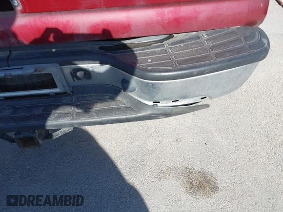 2003 Chevrolet Tahoe LS z VIN 1GNEK13Z73R127111, wystawiony jako IAAI lot #41830248 z przebiegiem Nie podano mil oraz . Historia ofert i sprzedaży dostępna na DreamBid. Obrazek 13.