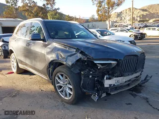 2020 BMW X5 sDrive40i with VIN 5UXCR4C00LLT18417, listed as a IAAI auction lot 40748214 with 68,795 mi miles. Bid and sale history available at carsss.com. Image 1.