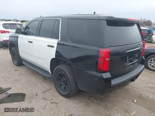 2018 Chevrolet Tahoe Commercial with VIN 1GNLCDEC1JR312458, listed as a IAAI auction lot 41371563 with 114,086 mi miles. Bid and sale history available at carsss.com. Image 3.