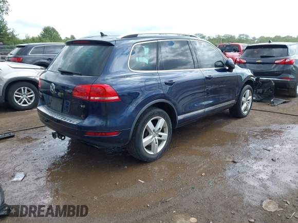 2011 Volkswagen Touareg Sport z VIN WVGFF9BP0BD002958, wystawiony jako IAAI lot #42281009 z przebiegiem 147 801 mil mil oraz . Historia ofert i sprzedaży dostępna na DreamBid. Obrazek 4.