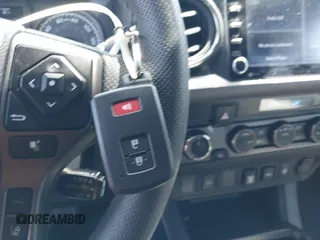 2023 Toyota Tacoma SR with VIN 3TMCZ5AN3PM590101, listed as a IAAI auction lot 42338670 with 12,970 mi miles and . Bid and sale history available at DreamBid. Image 11.