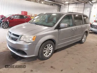 2014 Dodge Grand Caravan SXT with VIN 2C4RDGCG9ER213426, listed as a IAAI auction lot 41044553 with 175,140 mi miles and . Bid and sale history available at DreamBid. Image 2.