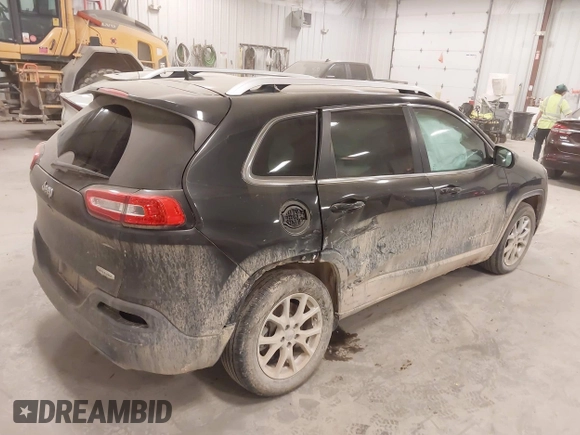 2015 Jeep Cherokee Latitude with VIN 1C4PJLCS8FW689849, listed as a IAAI auction lot 42144161 with 138,740 mi miles and . Bid and sale history available at carsss.com. Image 4.