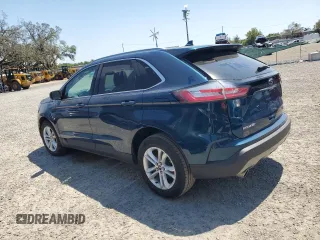 2020 Ford Edge SEL z VIN 2FMPK3J9XLBA59093, wystawiony jako Copart lot #52542645 z przebiegiem 128 059 mil mil oraz Czysty tytuł • Clean title. Historia ofert i sprzedaży dostępna na DreamBid. Obrazek 2.