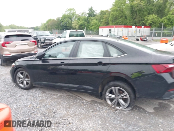 2023 Volkswagen Jetta SE z VIN 3VW7M7BUXPM061694, wystawiony jako IAAI lot #42231342 z przebiegiem 39 063 mil mil oraz . Historia ofert i sprzedaży dostępna na DreamBid. Obrazek 14.