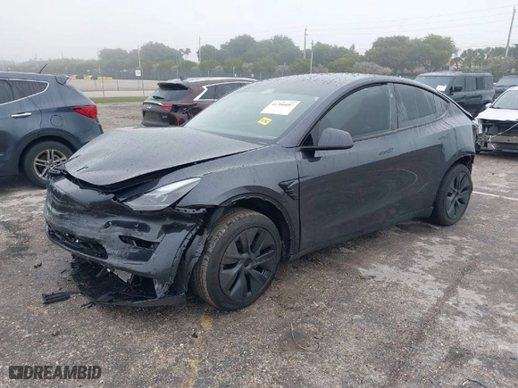 2024 Tesla Model Y with VIN 7SAYGDED8RF213927, listed as a IAAI auction lot 41386687 with 3,599 mi miles. Bid and sale history available at carsss.com. Image 2.