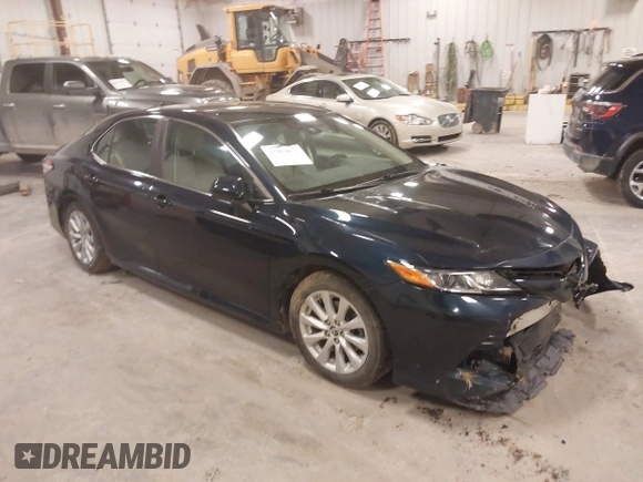 2020 Toyota Camry LE with VIN 4T1C11AK5LU926564, listed as a IAAI auction lot 41864812 with 104,212 mi miles and . Bid and sale history available at carsss.com. Image 1.