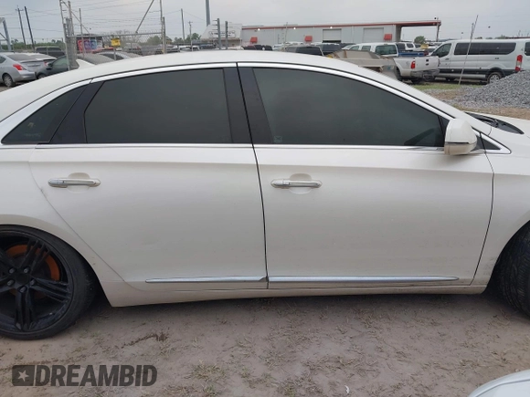 2013 Cadillac XTS Platinum z VIN 2G61U5S3XD9208737, wystawiony jako IAAI lot #41928451 z przebiegiem 167 984 mil mil oraz . Historia ofert i sprzedaży dostępna na DreamBid. Obrazek 13.