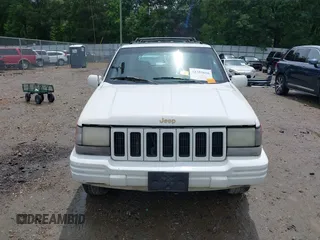 1996 Jeep Grand Cherokee Limited z VIN 1J4GZ78YXTC191527, wystawiony jako IAAI lot #42352616 z przebiegiem 325 927 mil mil oraz . Historia ofert i sprzedaży dostępna na DreamBid. Obrazek 13.