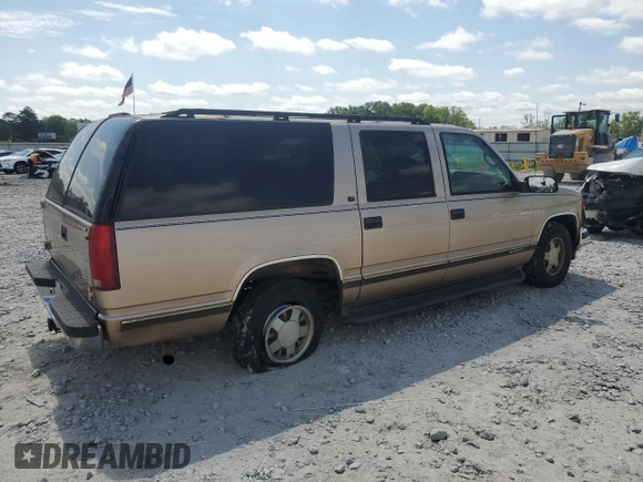 1999 Chevrolet Suburban with VIN 3GNEC16R6XG205408, listed as a Copart auction lot 57169415 with 303,412 mi miles and Salvage title. Bid and sale history available at DreamBid. Image 3.