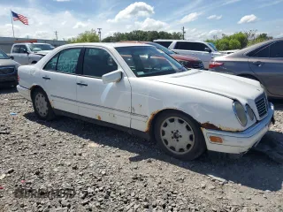 1999 Mercedes-Benz E-Class with VIN WDBJF65H0XA877630, listed as a Copart auction lot 69697454 with 0 mi miles and Salvage Title. Bid and sale history available at carsss.com. Image 4.