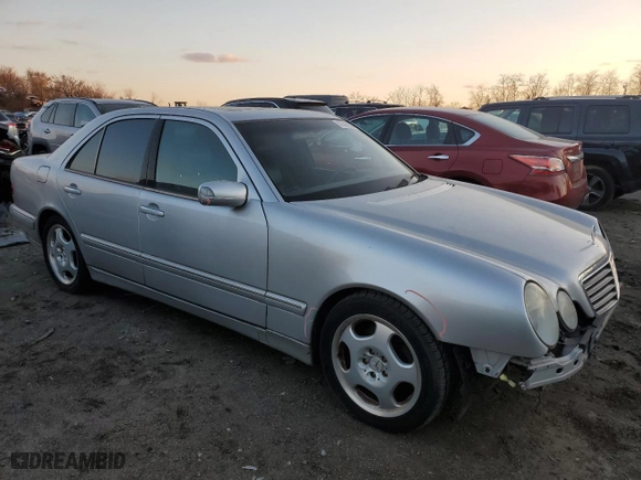 2000 Mercedes-Benz E-Class with VIN WDBJF70J7YB049473, listed as a Copart auction lot 82396624 with 197,515 mi miles and Salvage Title. Bid and sale history available at carsss.com. Image 4.