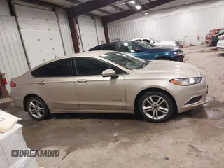 2018 Ford Fusion S z VIN 3FA6P0UU5JR100377, wystawiony jako IAAI lot #41300284 z przebiegiem 108 936 mil mil oraz . Historia ofert i sprzedaży dostępna na DreamBid. Obrazek 13.