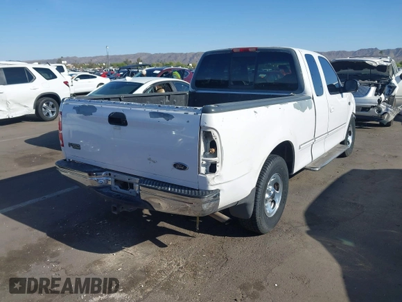1998 Ford F-150 with VIN 1FTZX1720WKB74924, listed as a IAAI auction lot 42046778 with 240,725 mi miles and . Bid and sale history available at DreamBid. Image 4.