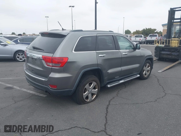 2013 Jeep Grand Cherokee Limited with VIN 1C4RJEBTXDC539433, listed as a IAAI auction lot 42046724 with 266,913 mi miles. Bid and sale history available at carsss.com. Image 4.