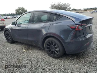 2024 Tesla Model Y Long Range with VIN 7SAYGDEE4RA285620, listed as a Copart auction lot 57883015 with 18,841 mi miles and Salvage title. Bid and sale history available at DreamBid. Image 2.